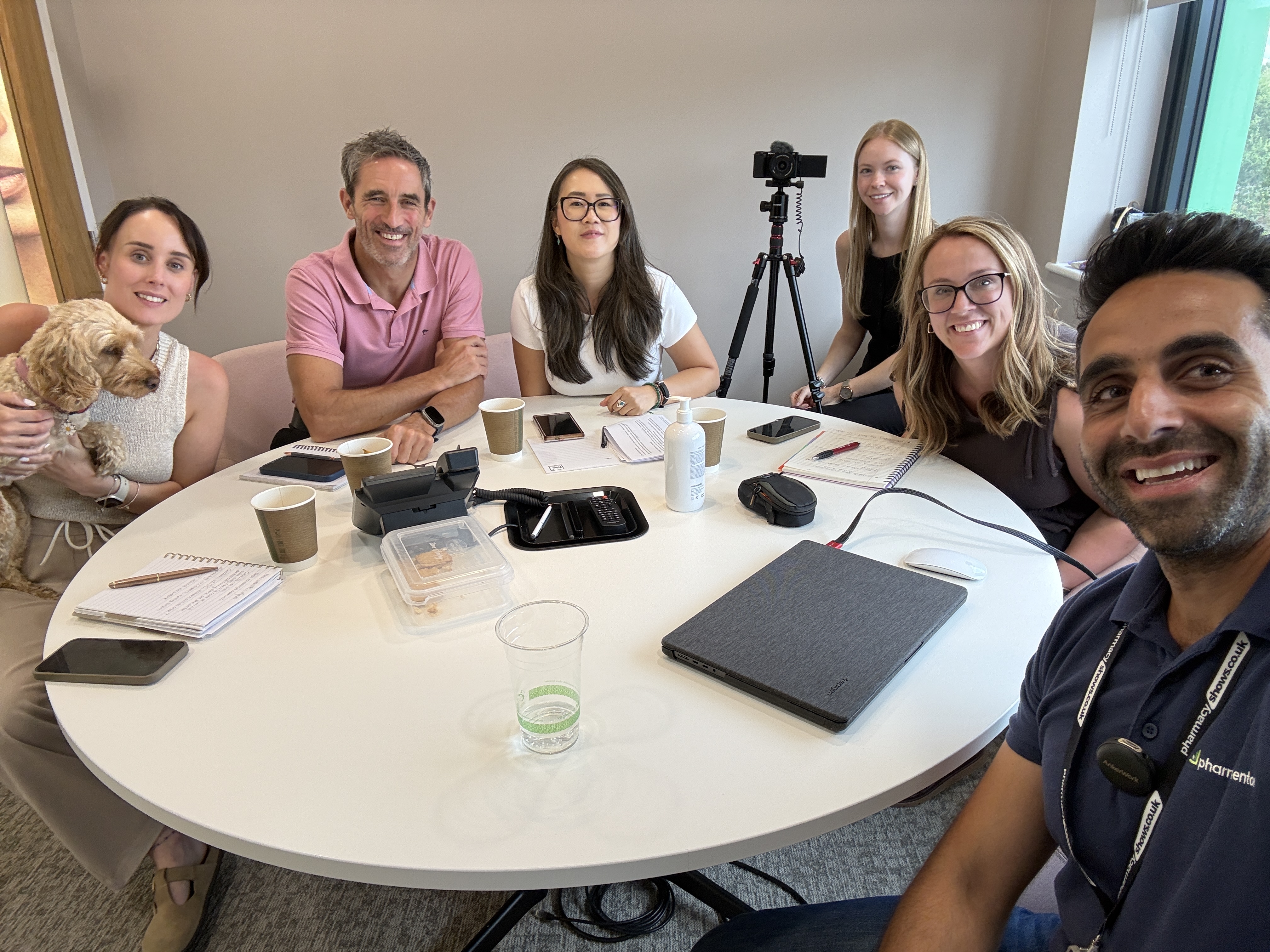 Pharmacy Mentor team collaborating around a meeting table